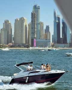 Guests enjoying a luxury yacht rental on the best yacht routes from Dubai Marina.